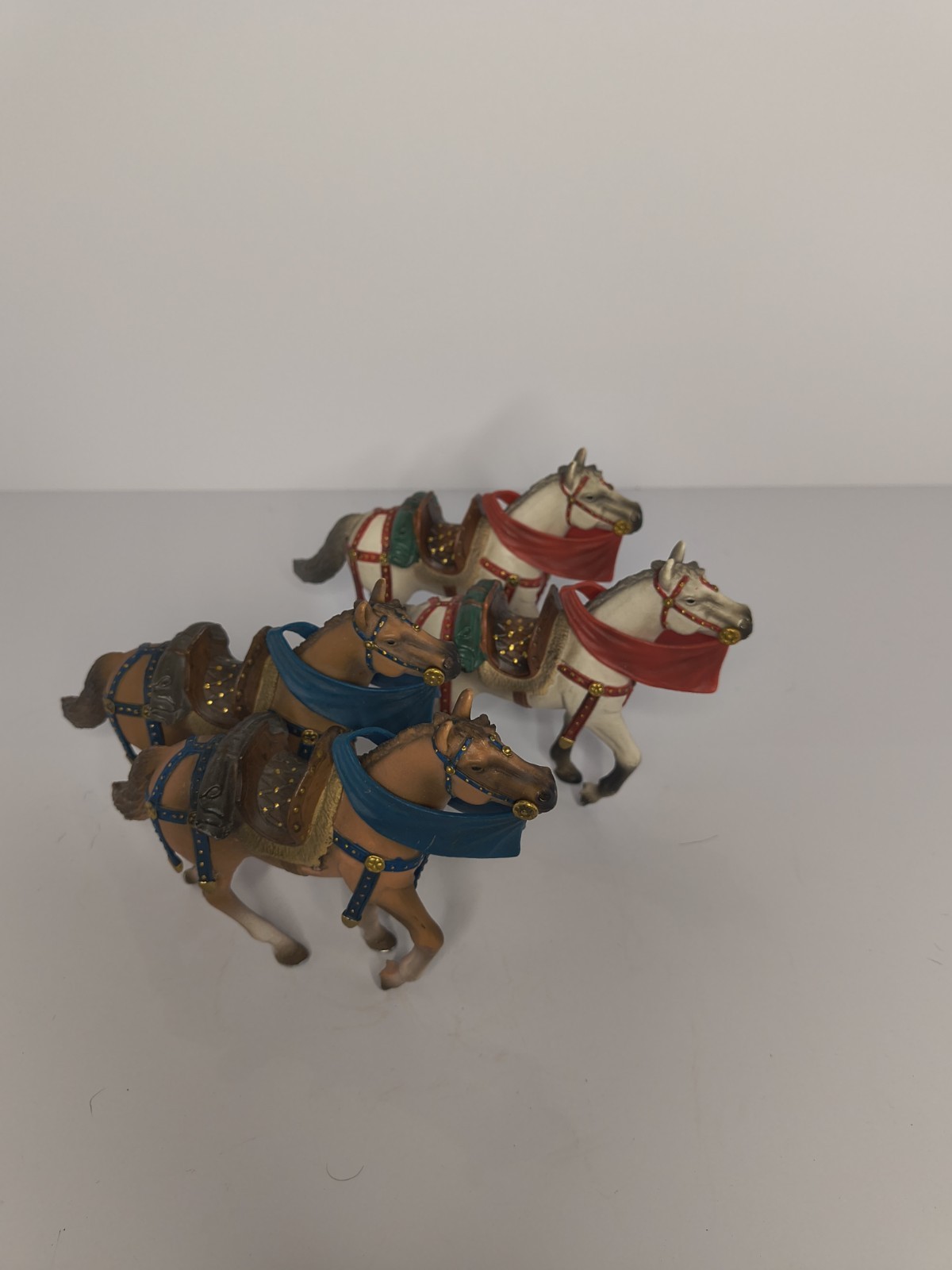 Set of 4 Painted Toy Soldier Horses with Saddles, Harnesses, Red Blue Accents