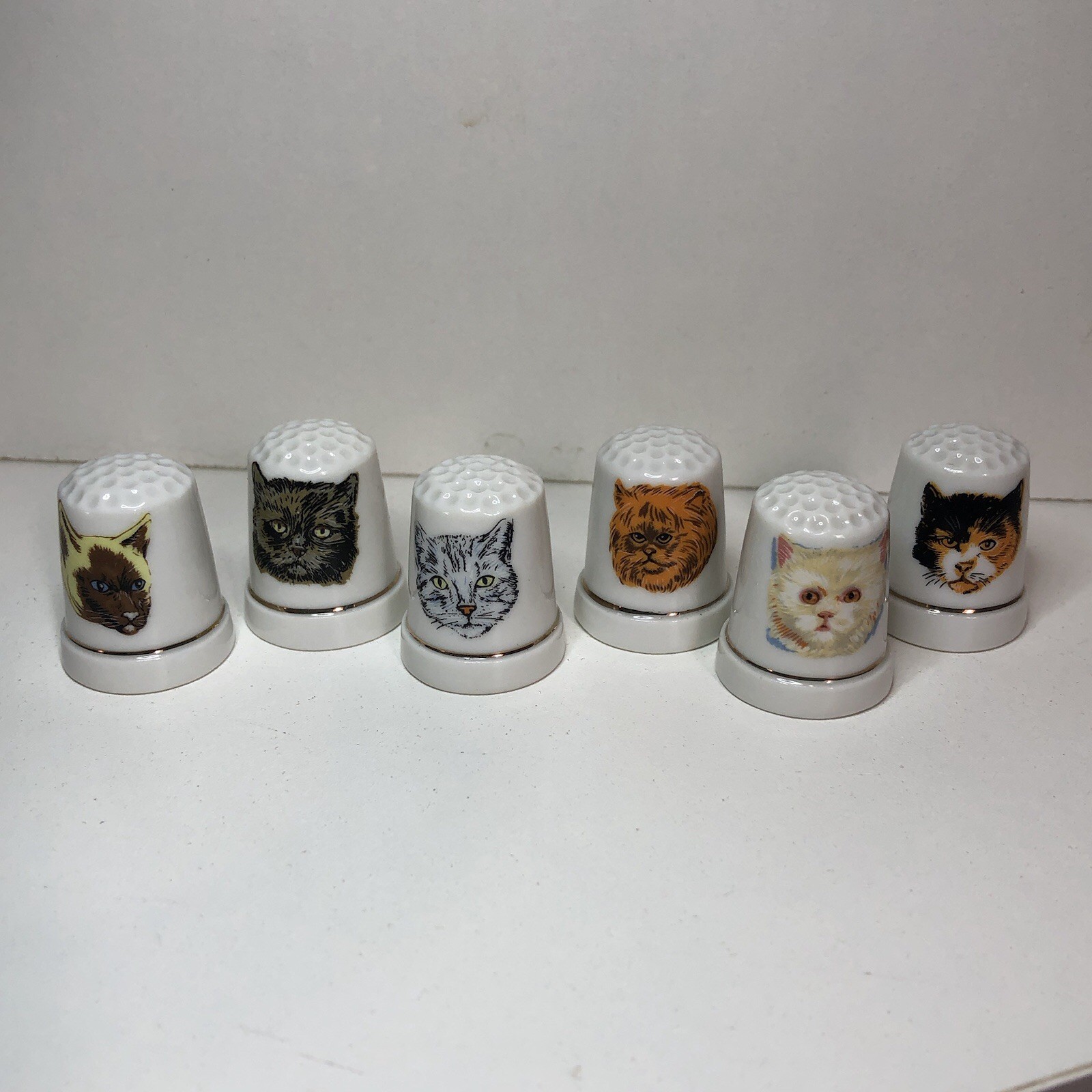 Lot of 6 Porcelain Cat Face Thimbles White Gold Rim SDJ-TG