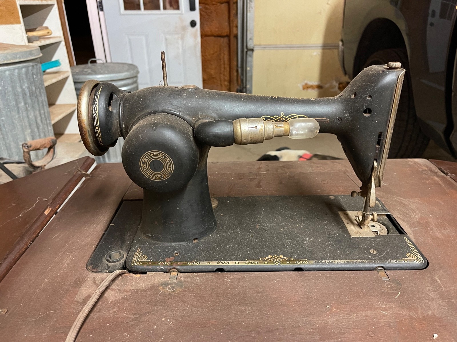 antique singer sewing machine in cabinet