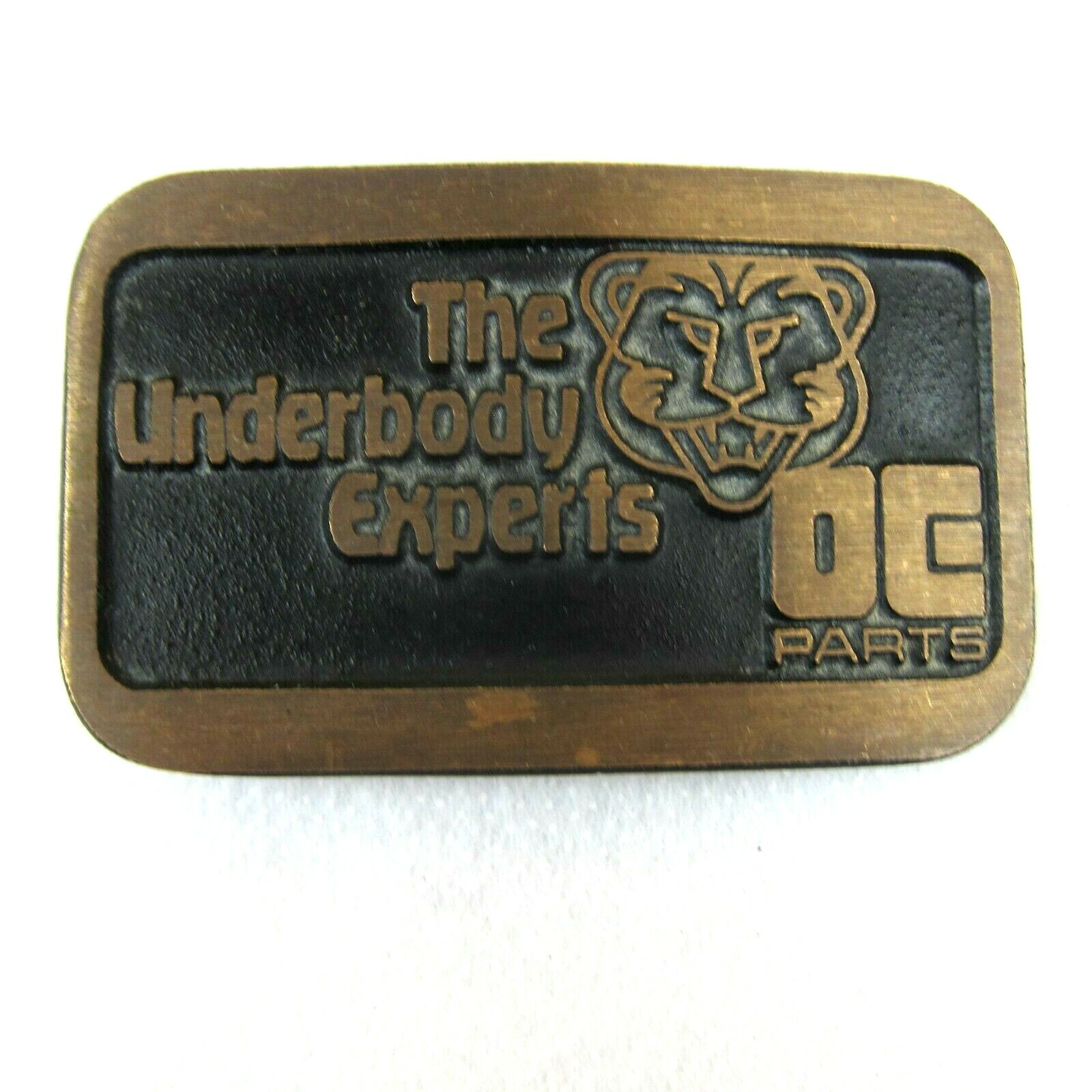 Vintage DE Parts Underbody Experts Belt Buckle Brass Car Mechanic Advertise USA