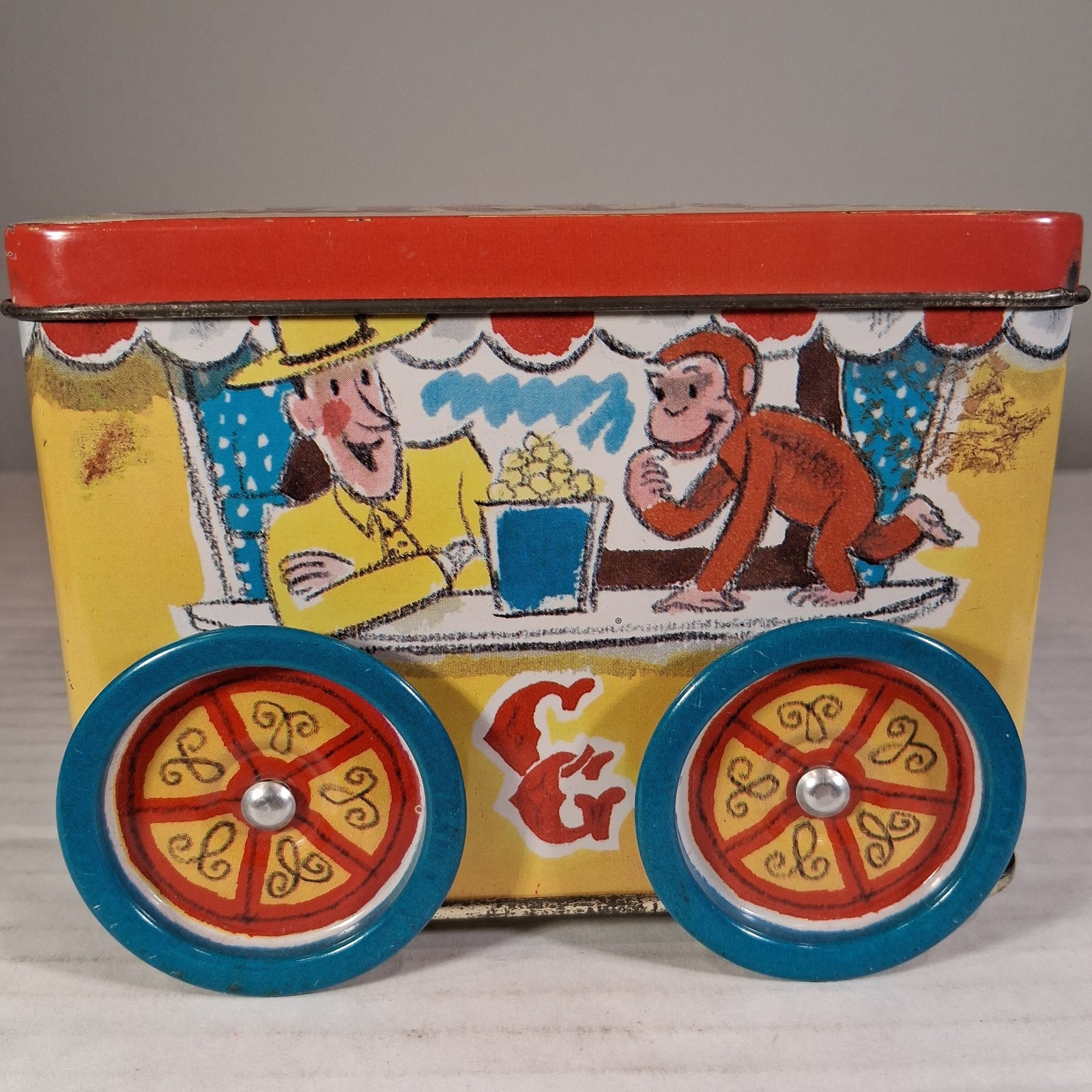 Curious George Tin Coin Bank Rolling Circus by Schylling 