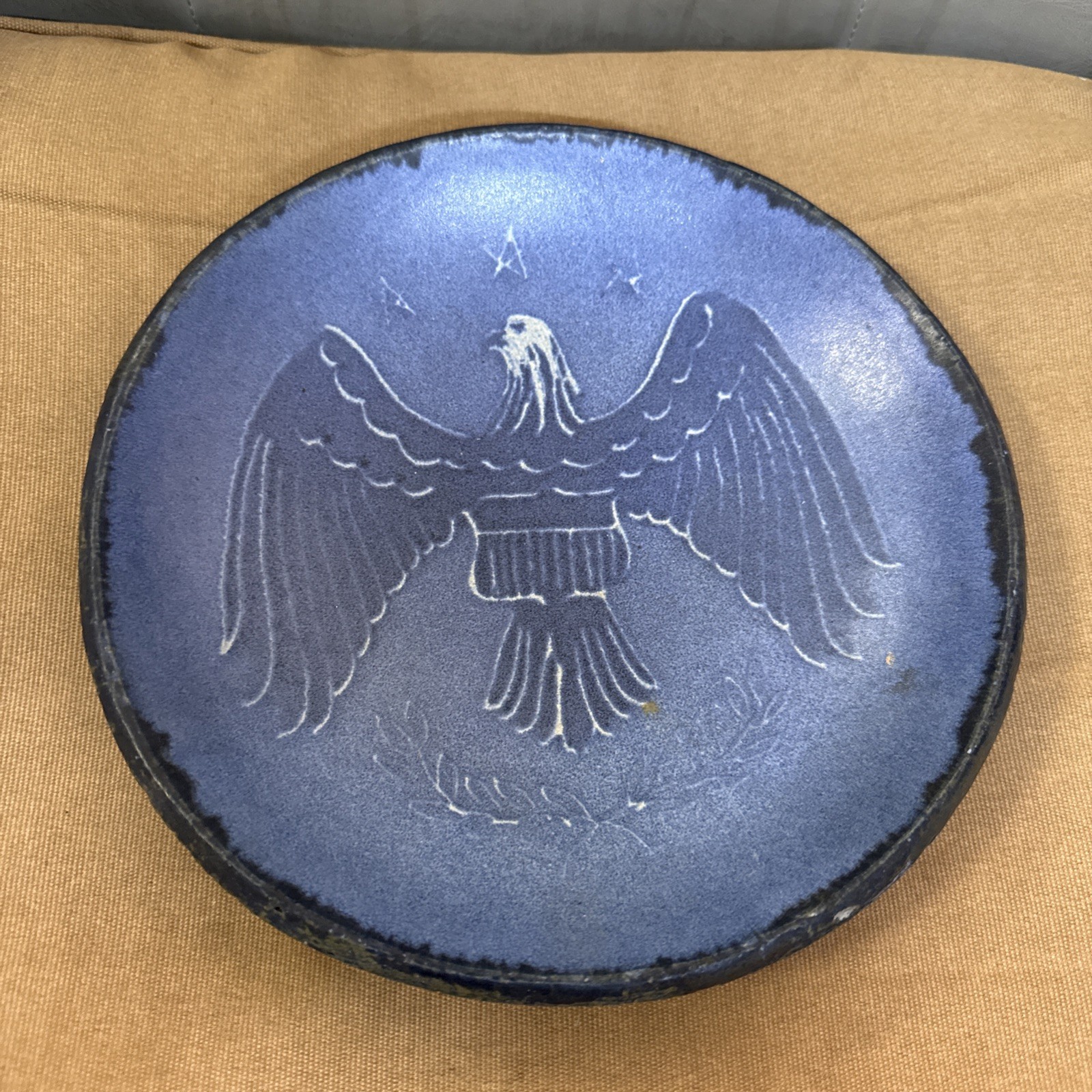 Vintage blue painted Earth ware pan. Eagle with stars.