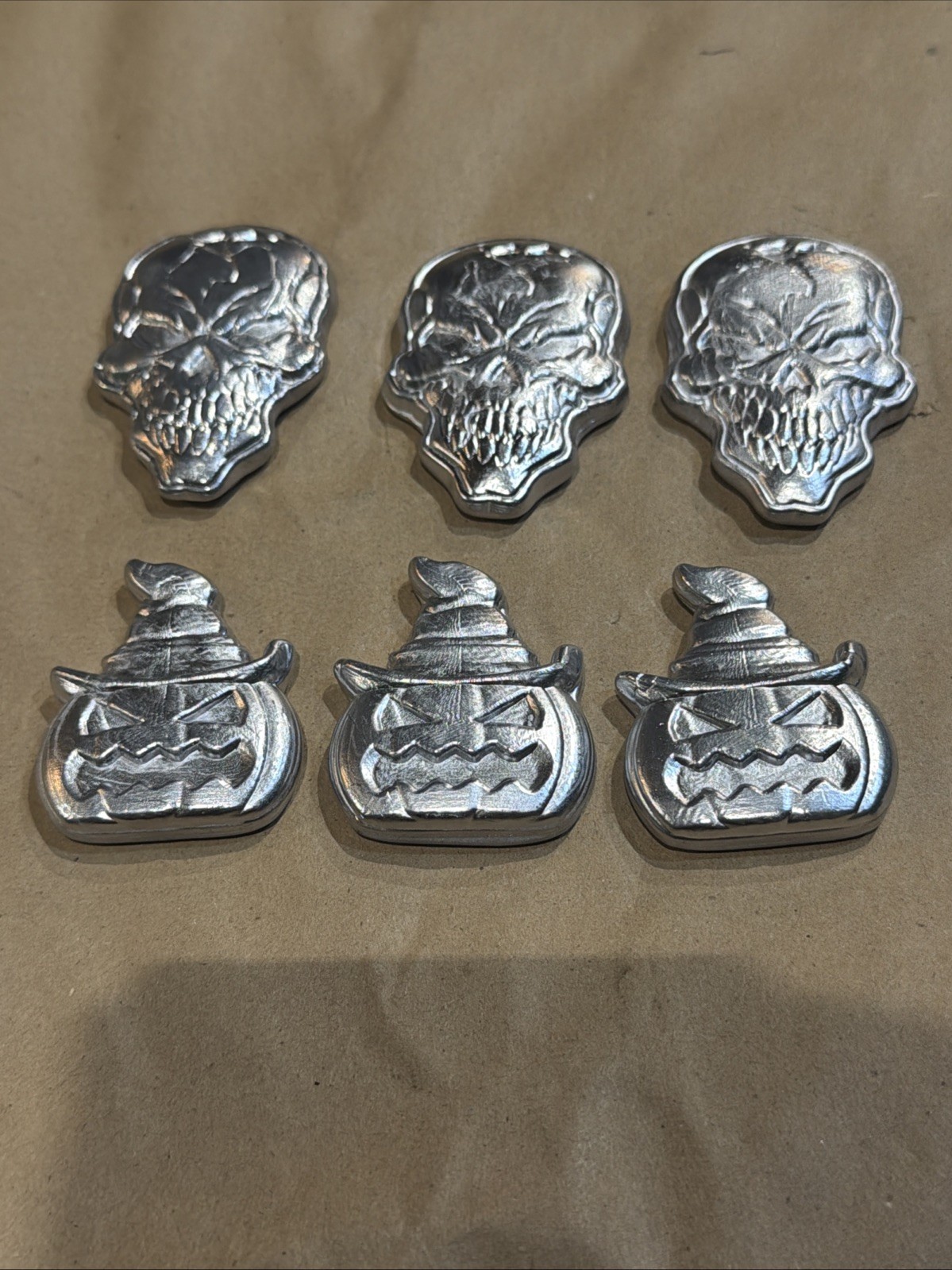 Handcrafted Lead Skulls And Evil Pumpkins – 6 Pieces of Solid Metal Badassery!