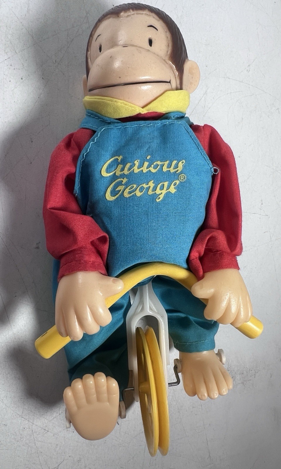 Vintage Curious George on Unicycle Small Toy Plastic Movable Wheel 8 Inch Tall