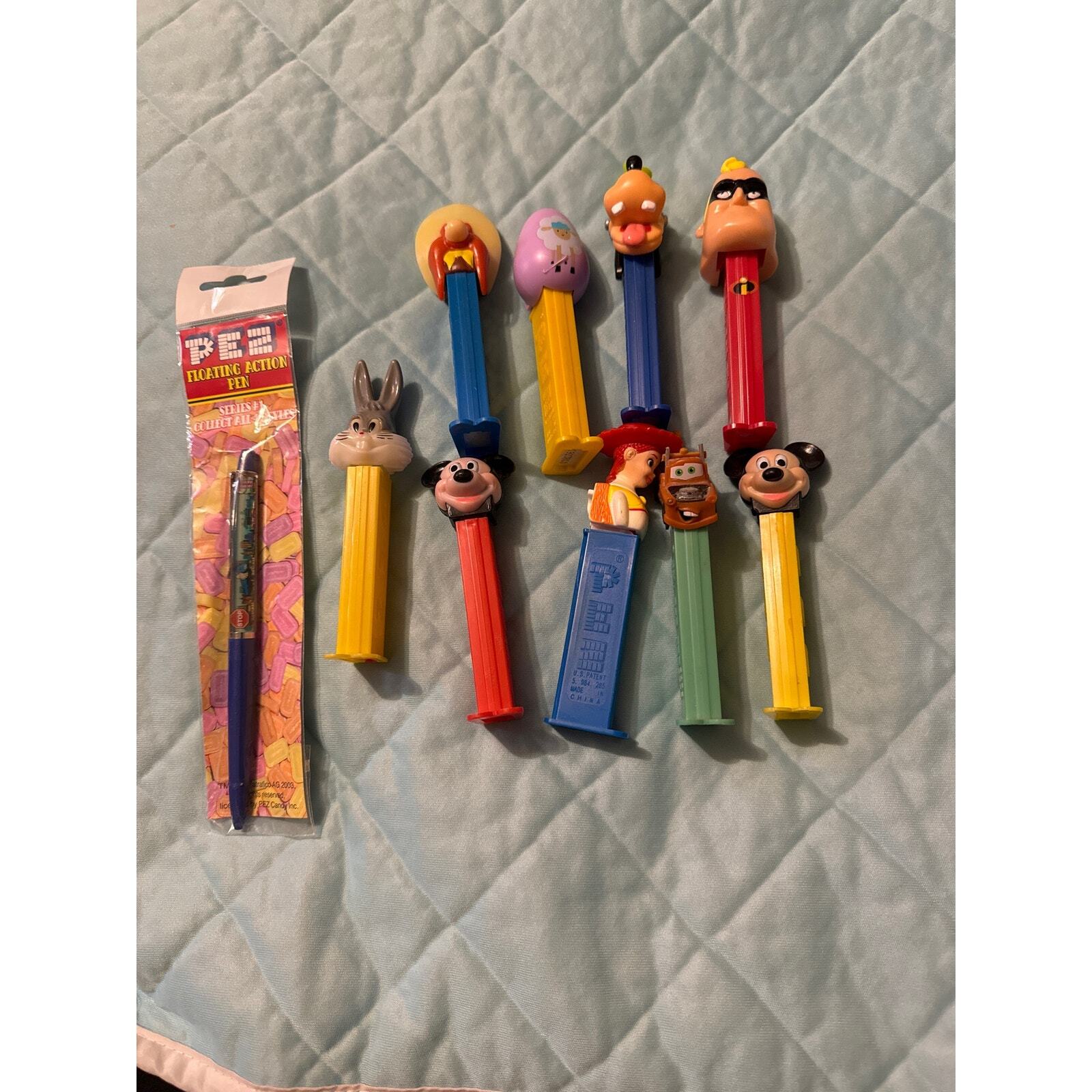 BT Vintage Pez dispensers Disney, Bugs bunny and more plus a Pez floating pen.