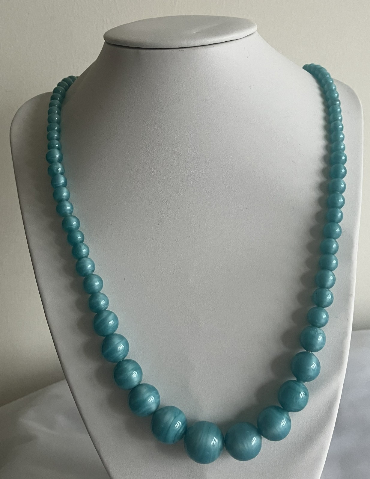 Turquoise colored beaded necklace, 23 inches in length
