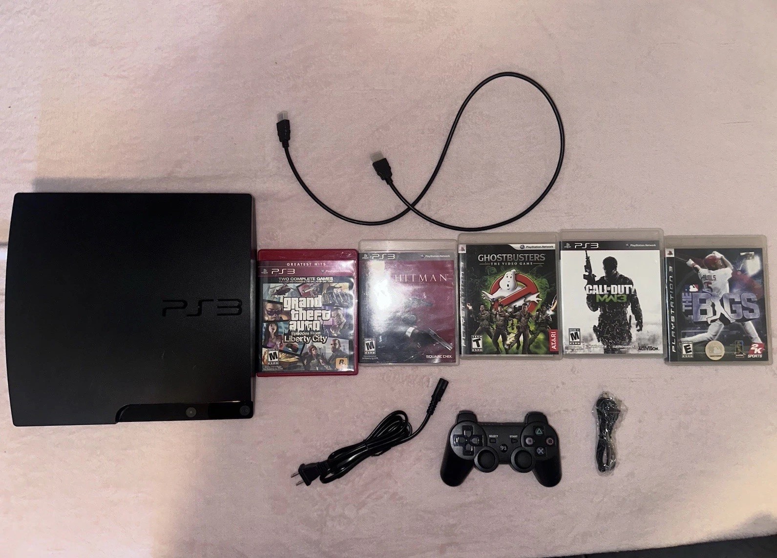 Sony PlayStation 3  160gb Console Bundle with Controller, Cables, and 5 Games.