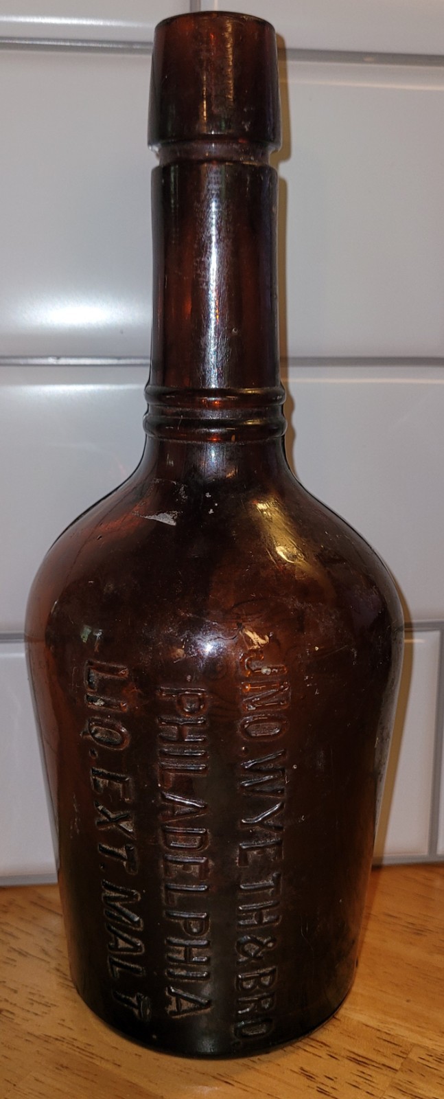 Antique JNO Wyeth & Bro Embossed Glass Bottle Liq Ext. Malt Philadelphia Amber