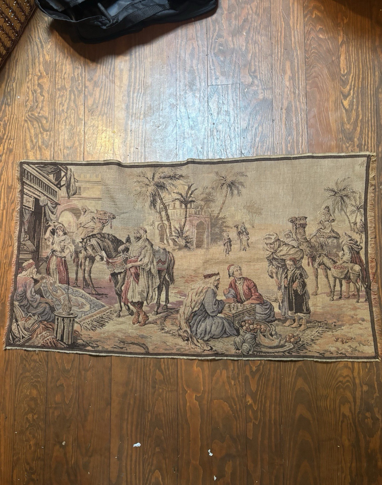 vintage Belgian tapestry depicting a Middle Eastern market scene