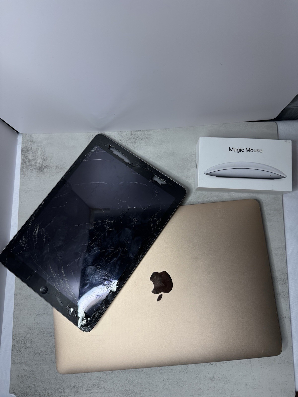 Lot Of Apple Products Macbook Air, iPad Air 1st Gen, and Magic Mouse 2 FOR PARTS