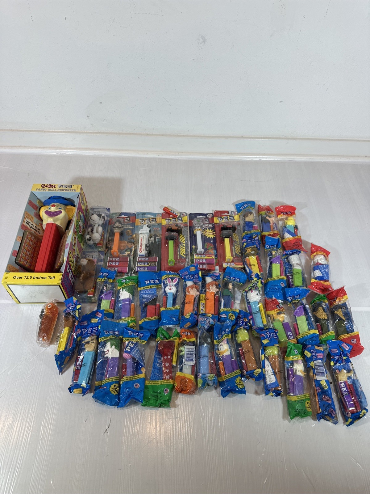Lot of 41 Packaged PEZ Assorted Characters Vintage With Feet