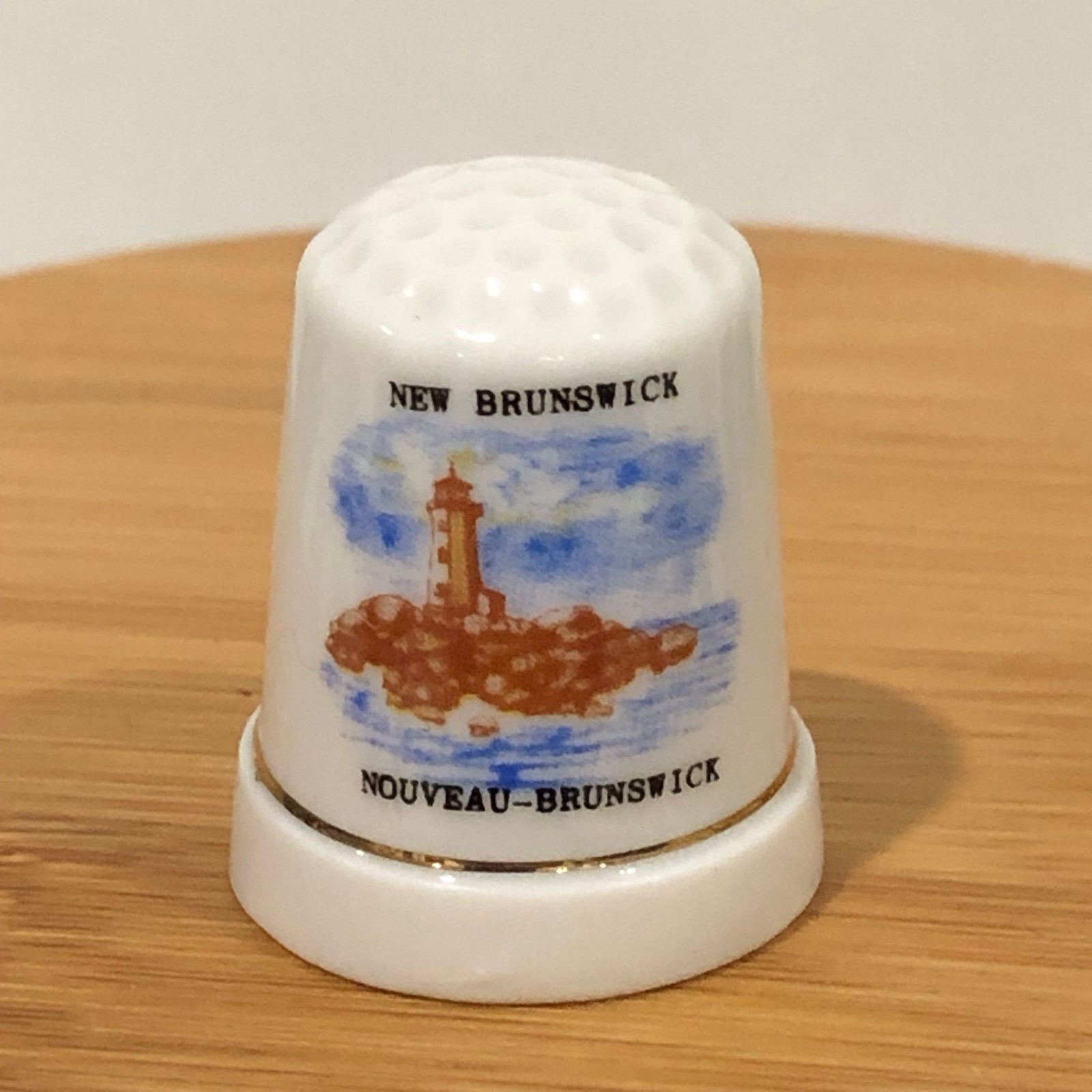 Souvenir Porcelain Thimble New Brunswick Lighthouse Gold Trim White Collectible