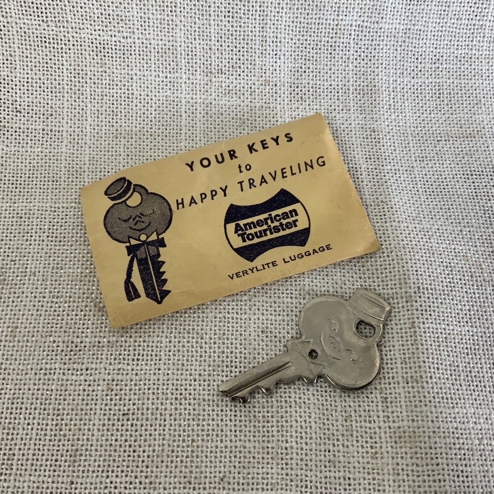American Tourister Vintage Luggage Key 1.75" Smiling Bell Hop Shape
