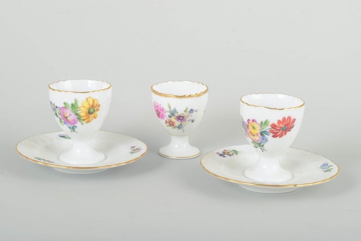 Royal Copenhagen, Saxon Flower. Three porcelain egg cups. C. 1900.