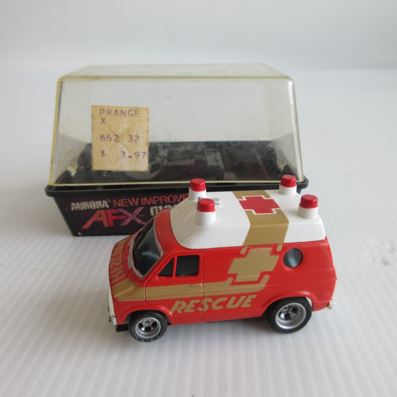 runs Aurora AFX Magnatraction Dodge Rescue Van Slot Car - #1937 in cube