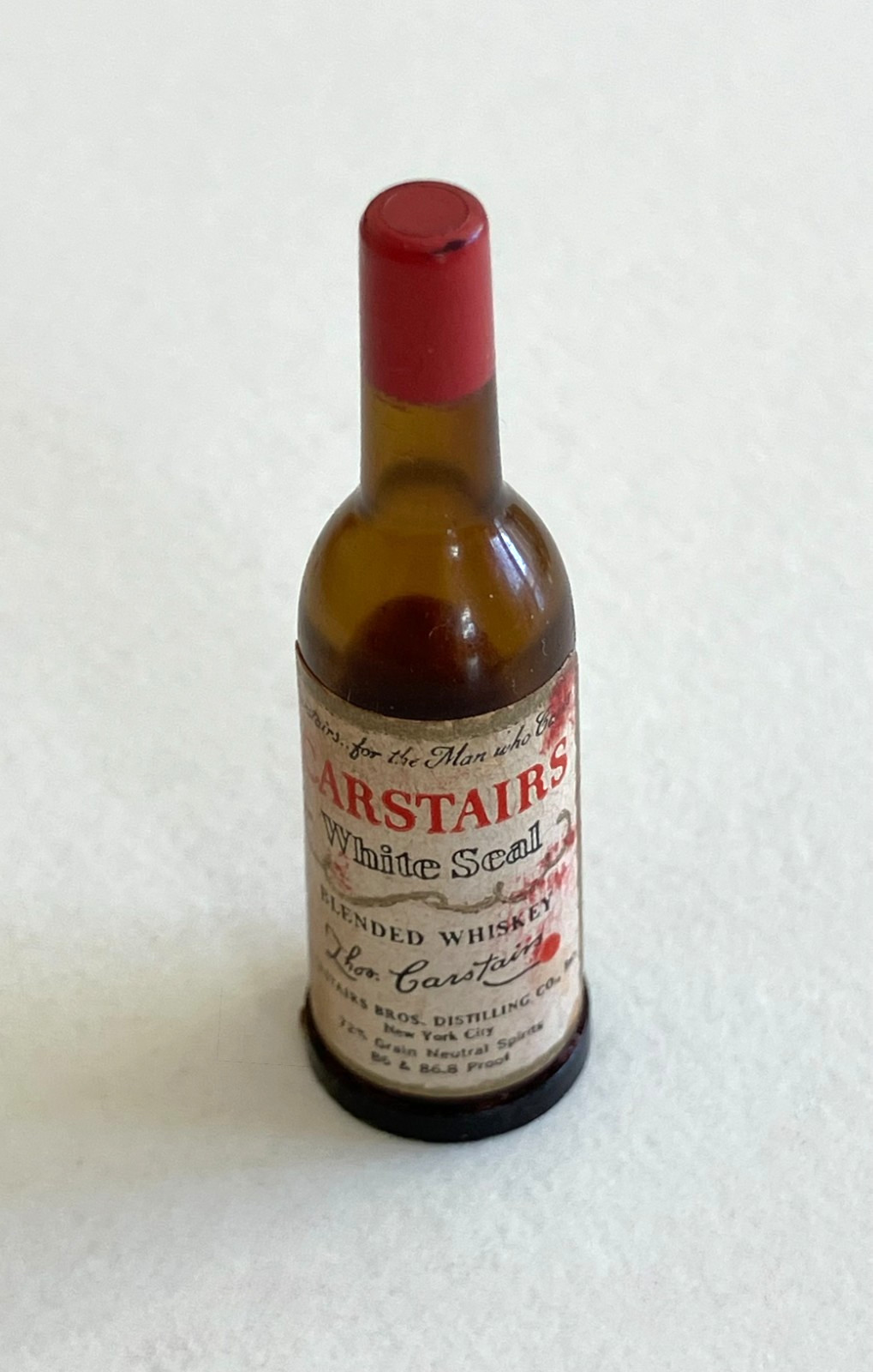 Vintage key chain with liquor bottle and lipstick