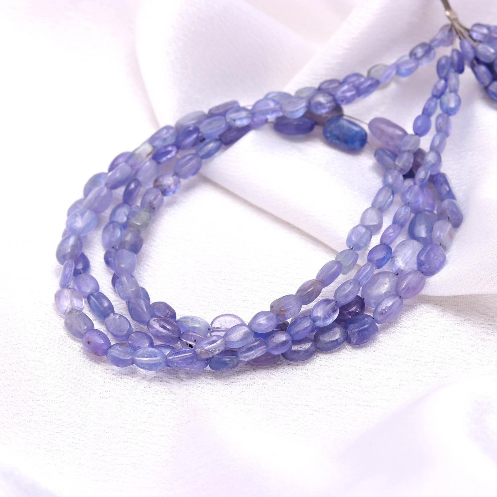 Natural Tanzanite Oval Beads, AAA Smooth Gemstone Strand - 16 Inch
