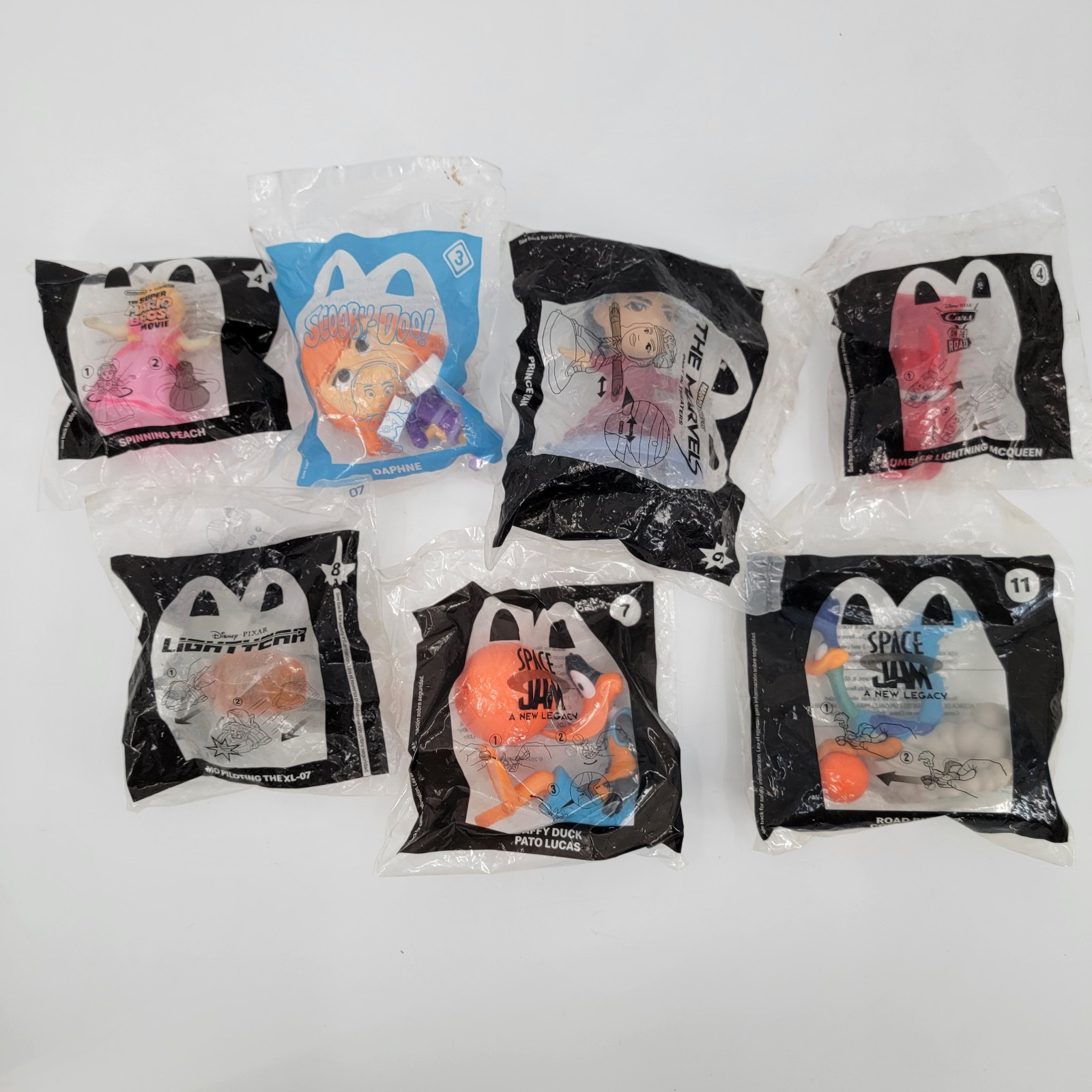 Lot of 7 Sealed McDonald’s Happy Meal Toys 2000s Space Jam Scooby Pixar Marvel