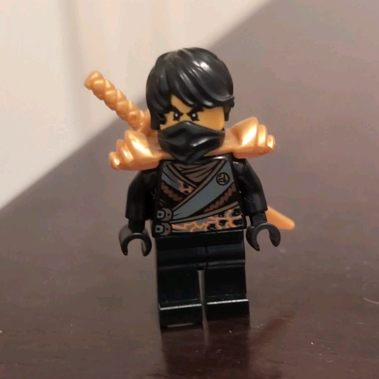 LEGO NINJAGO Ninja Minifigure with Gold Sword, Black Outfit, and Armor