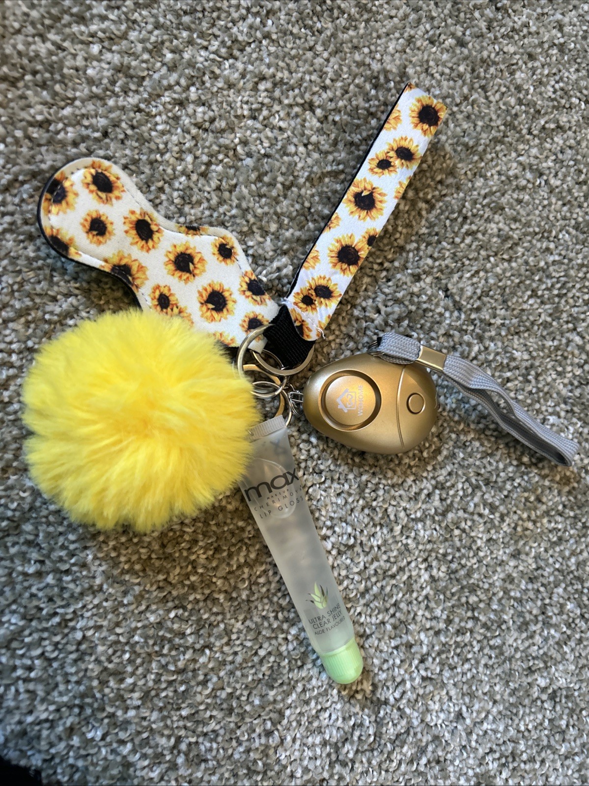 This is a sunflower-patterned self-defense keychain set