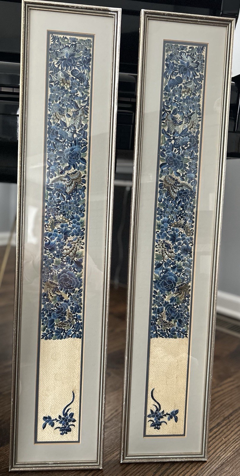 A pair of vintage framed Chinese embroidered silk panels with floral motifs