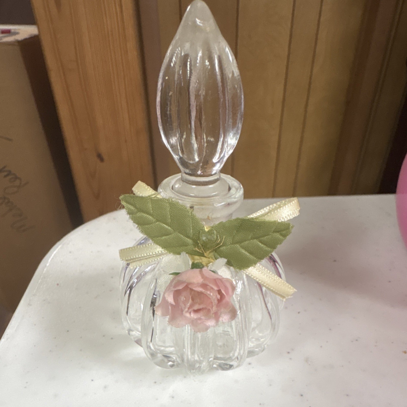 Vintage Glass Perfume Bottle with Pink Flower and Ribbon Accent