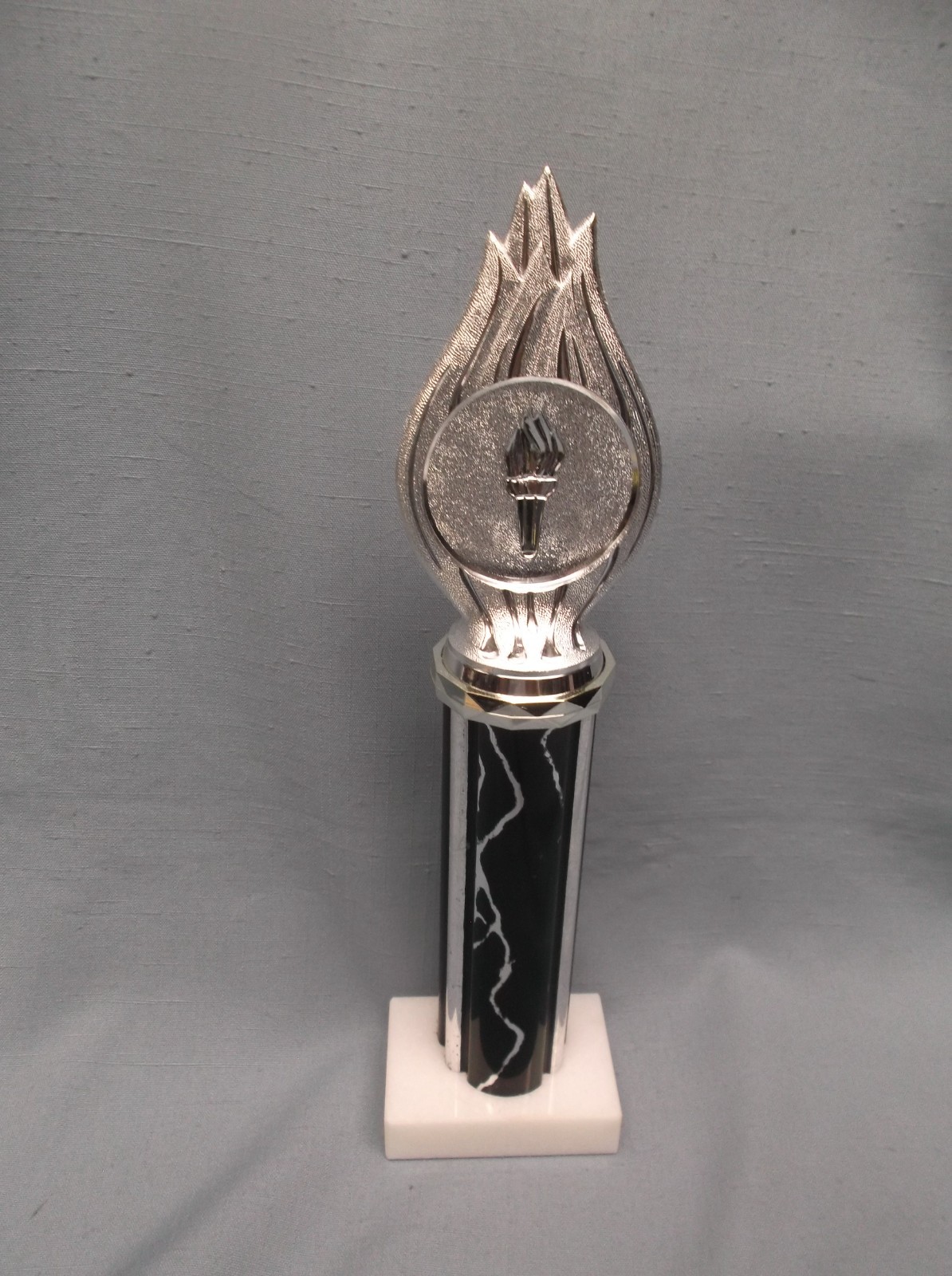 silver torch black column trophy award white marble base