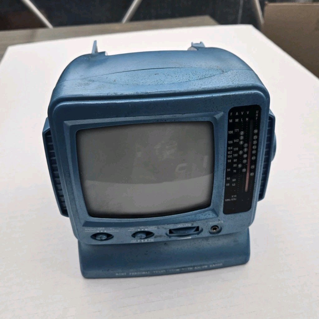 Vintage Blue 5" Black & White TV Radio Receiver with AM/FM Radio, powers on.