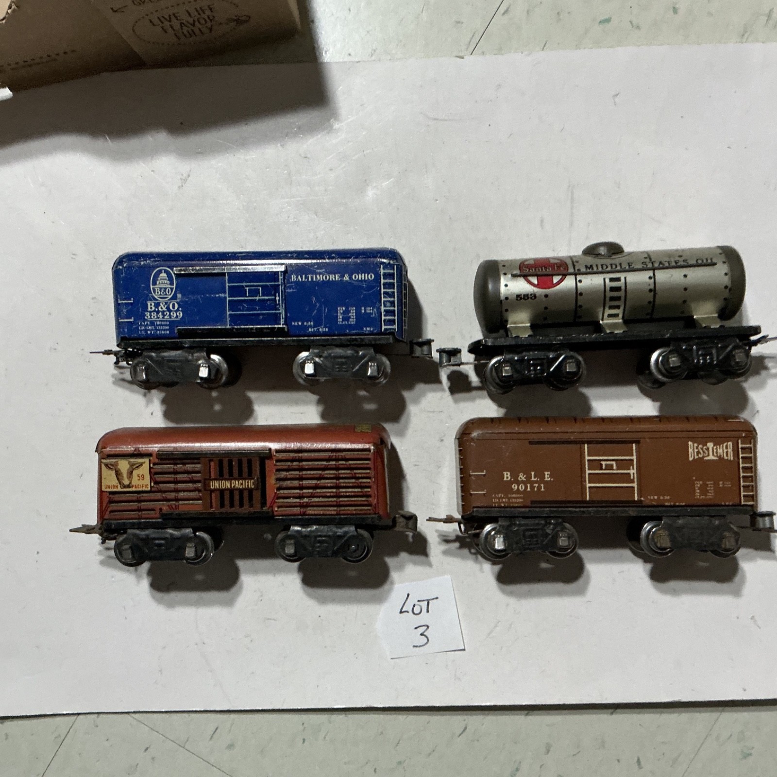 Marx 0 Gauge :  3 box  cars & 1 tank car :  with 1 way couplers.  Lot 3