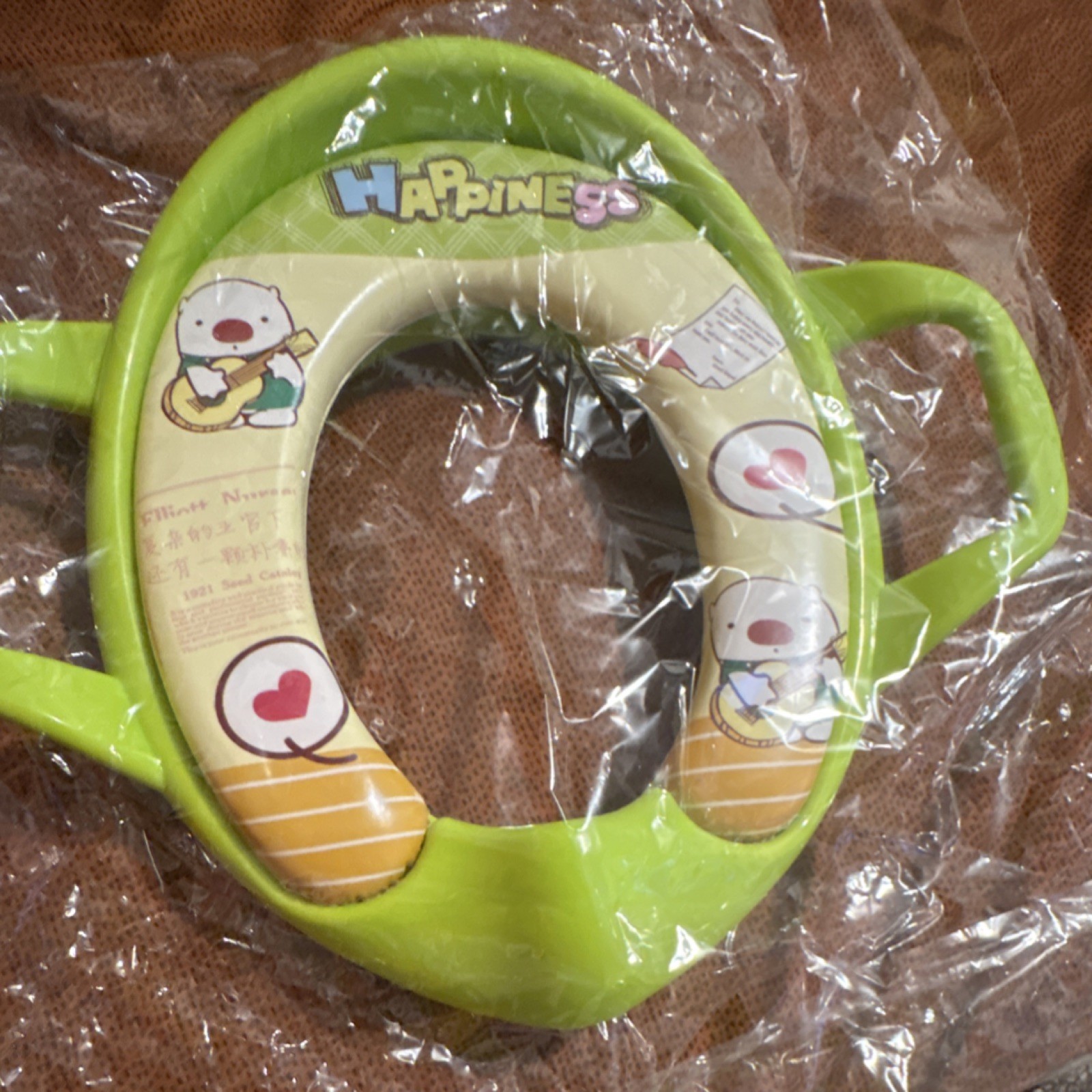 Happiness Green Potty Training Seat with Handles and Cartoon Graphics