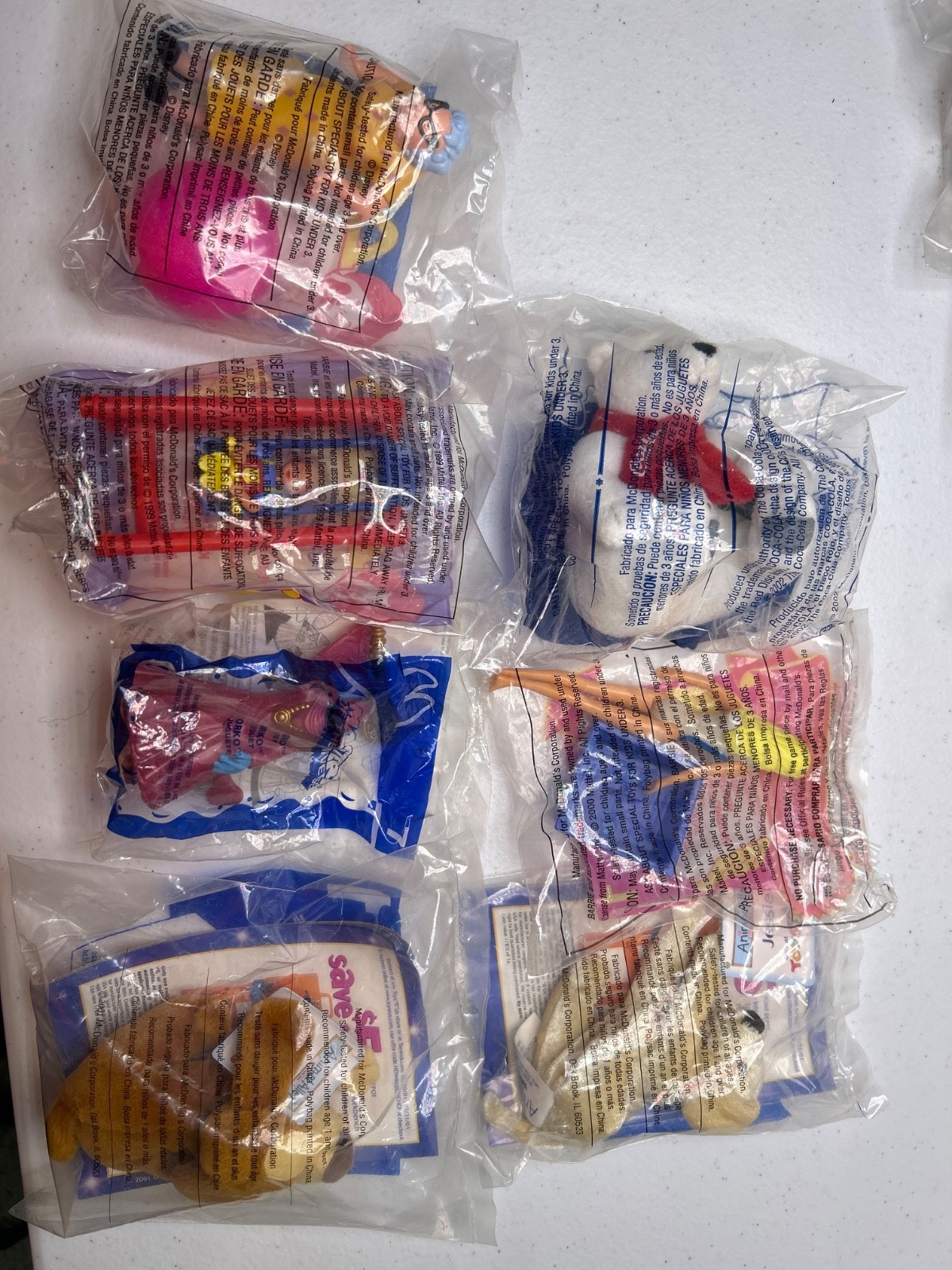 seven McDonald's toys all still in package random collection.