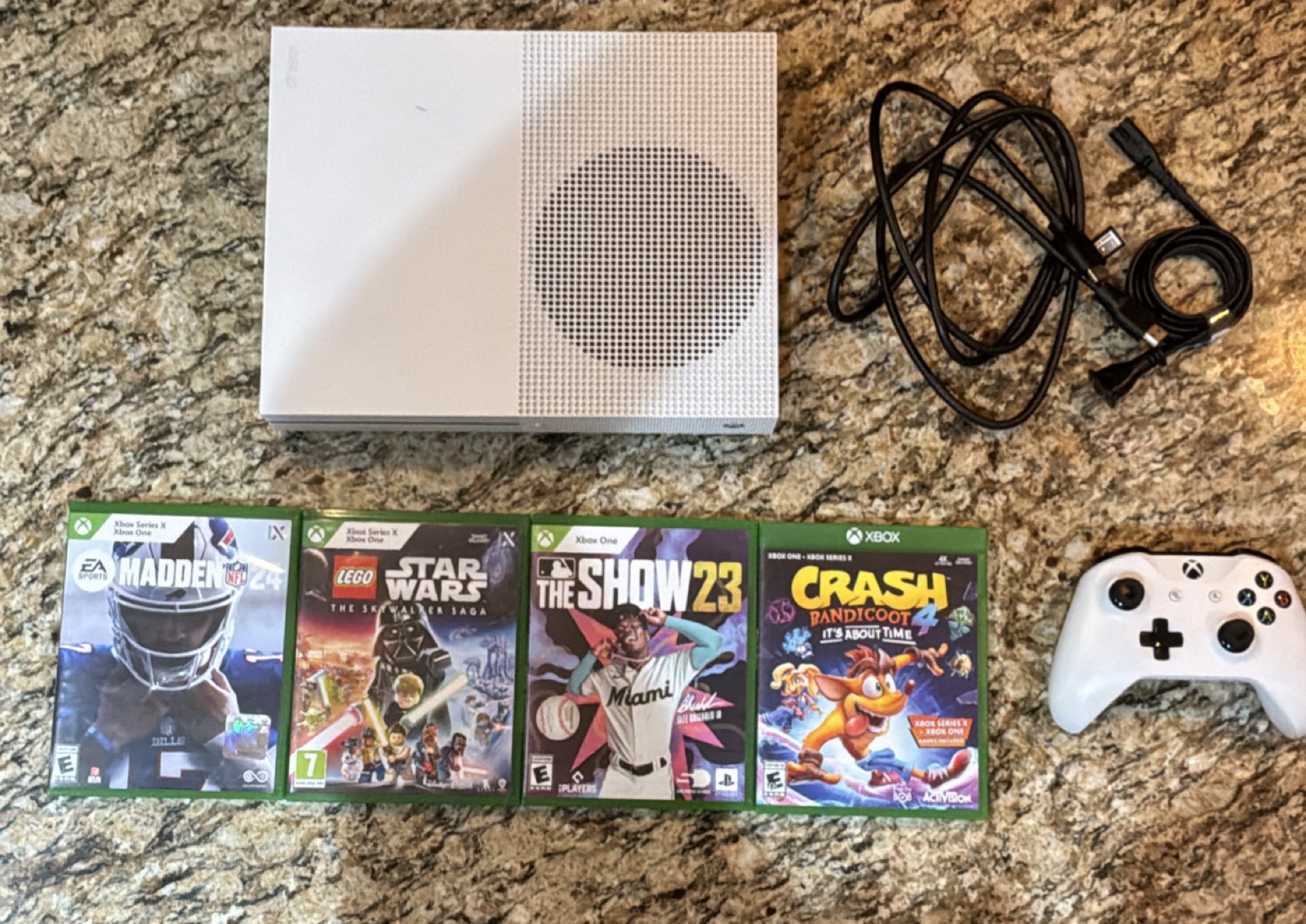 Xbox one with Games, Power cables, and a Controller 