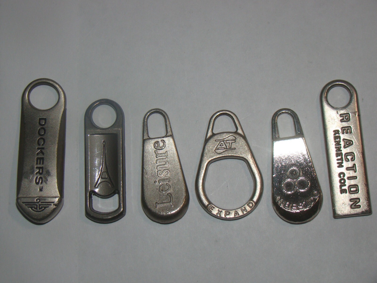 Lot of (6) Assorted Luggage Replacement Zipper Pulls.