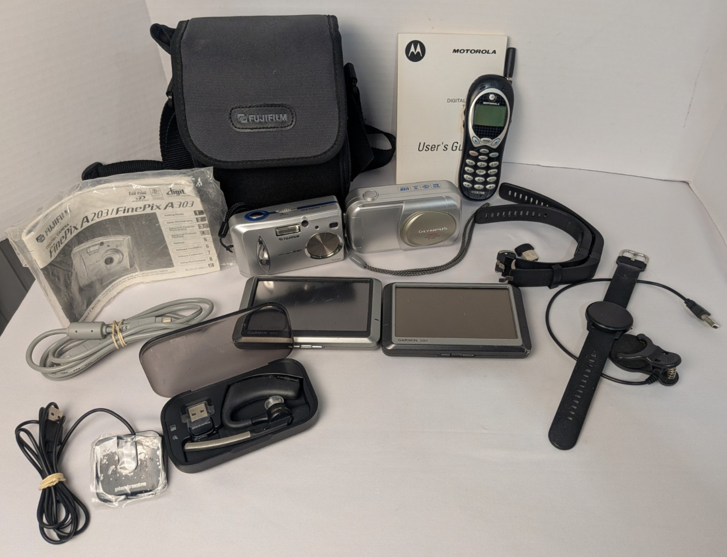 Mixed Lot of Used Goods Consumer Digital Cameras, Fitness Watches, Vintage Cell
