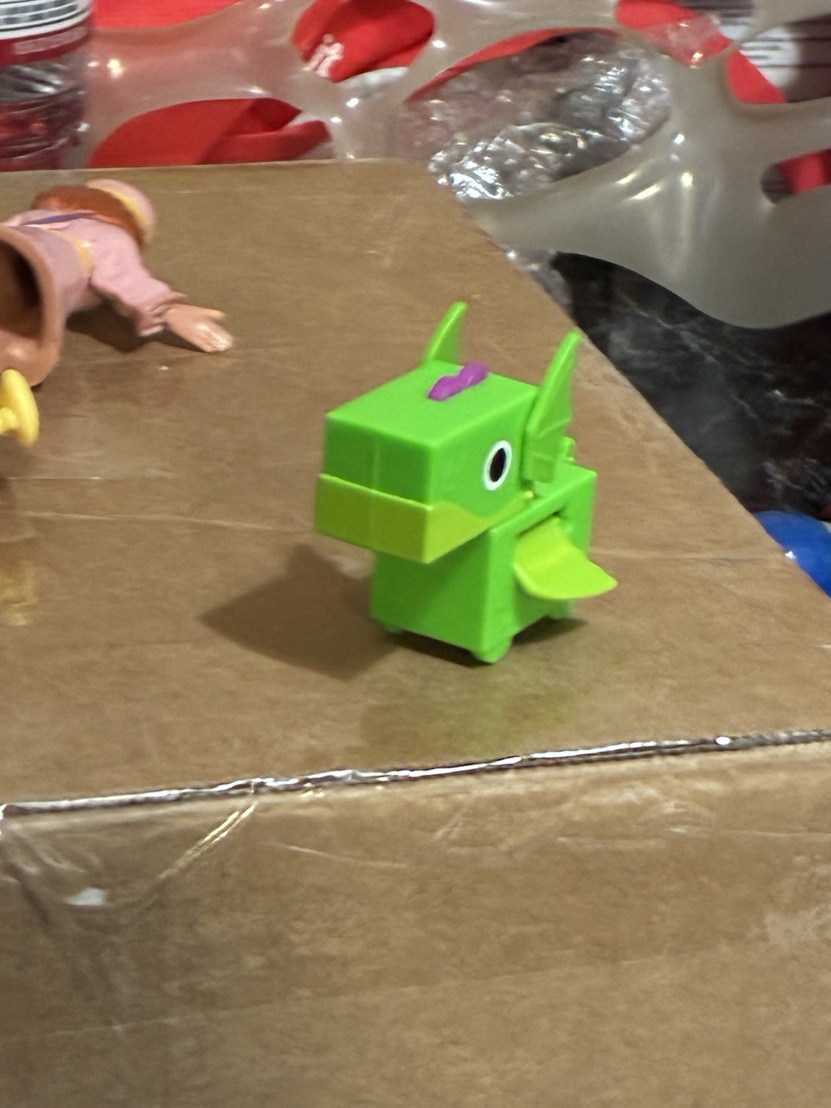 green dragon figure from the Pet Simulator X Fidget Pets series. 