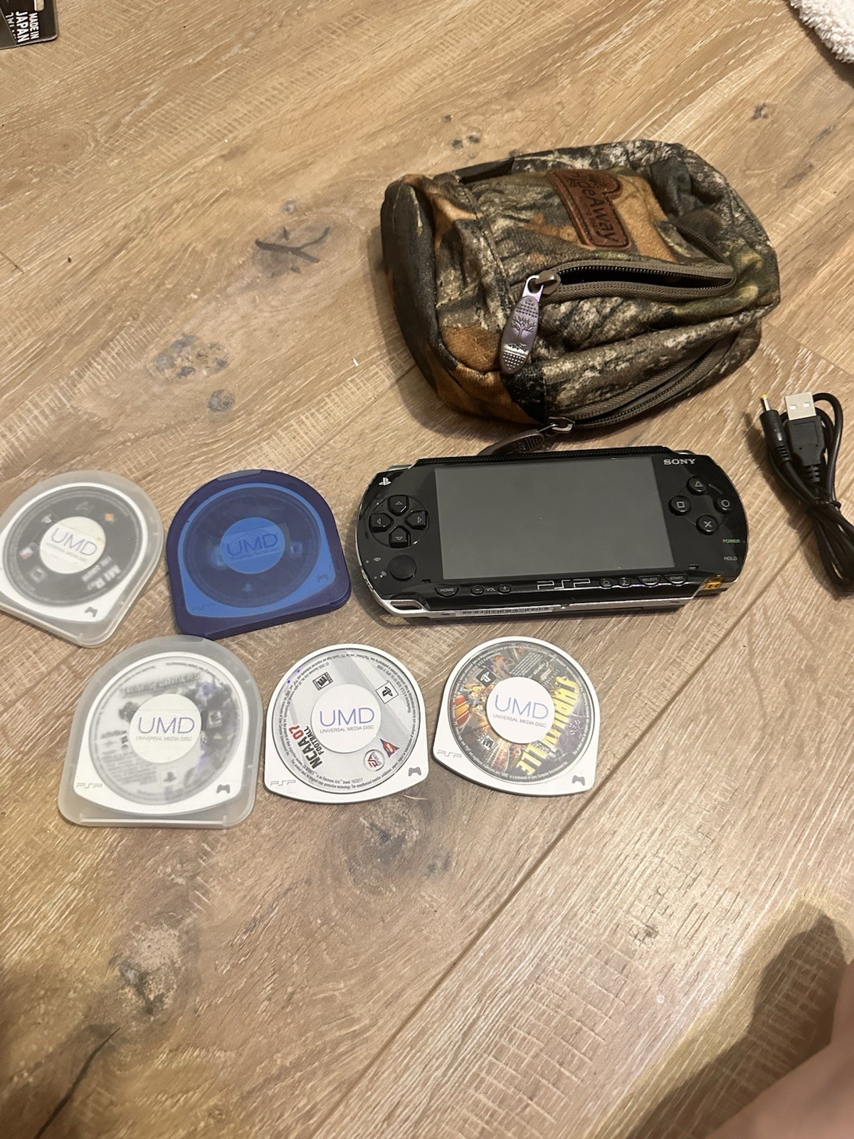 Sony PSP Console w/ Carrying Case, Charger, 5 Games (Transformers, Baseball)
