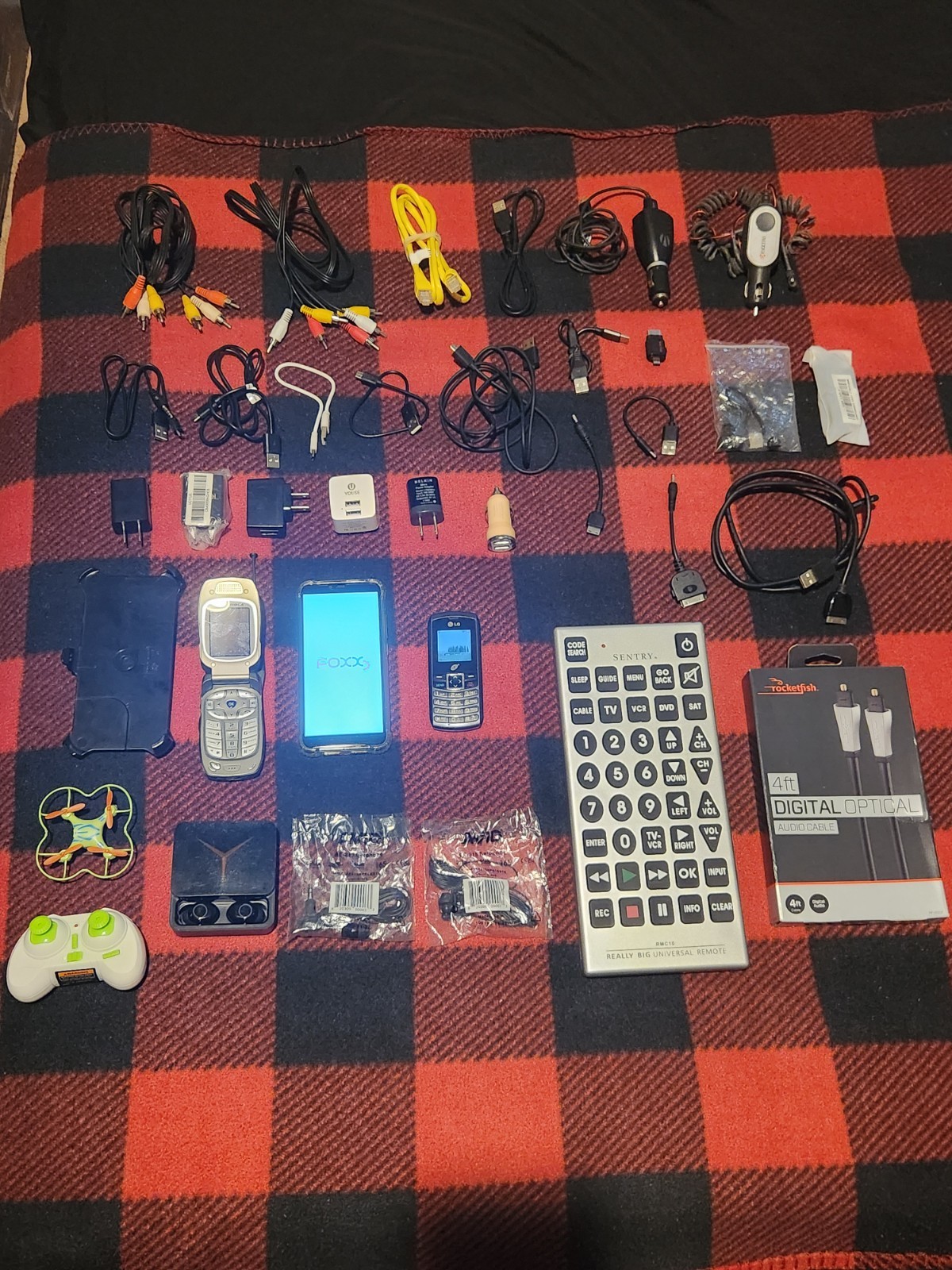 Elctronics Lot, Cellphones, Charging Cords, Remotes, And More