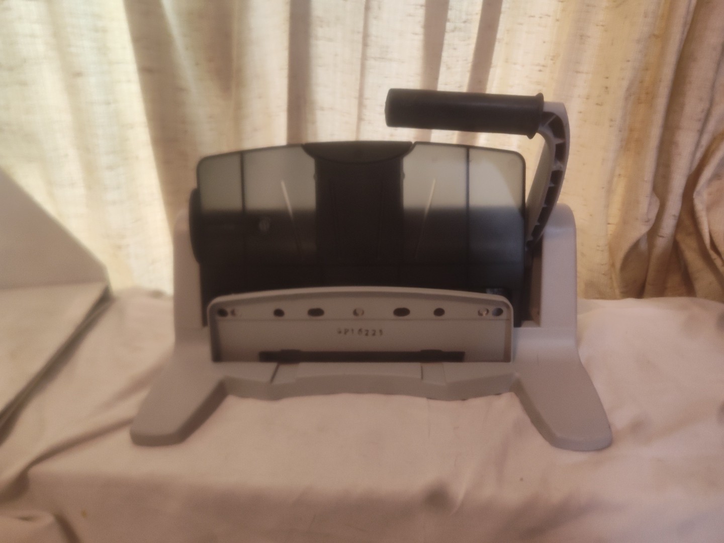 Swingline LightTouch Heavy Duty 2 to 7 Hole Punch, model number 74357.