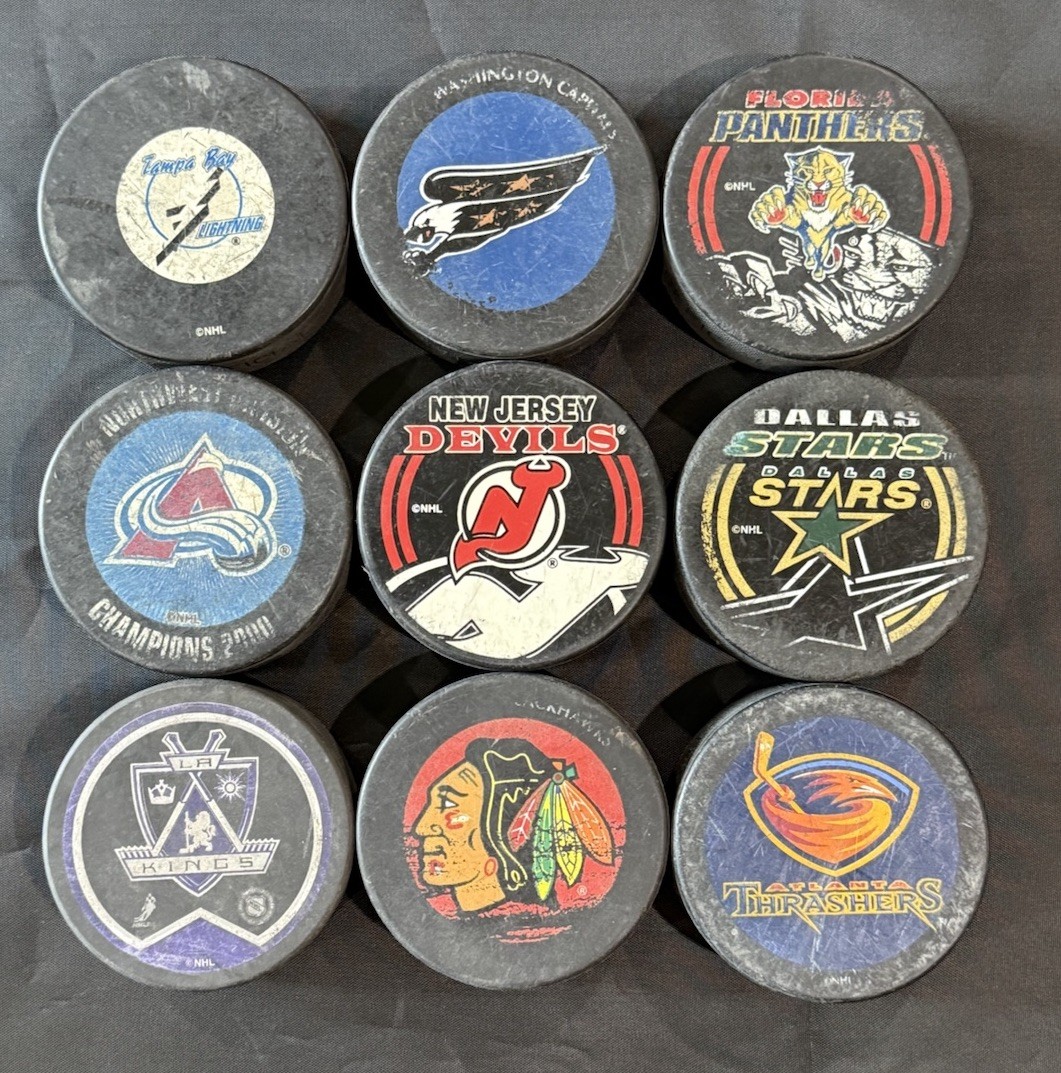 (9) NHL Official Hockey Puck Lot, Avalanche, Blackhawks, Kings, Stars & More