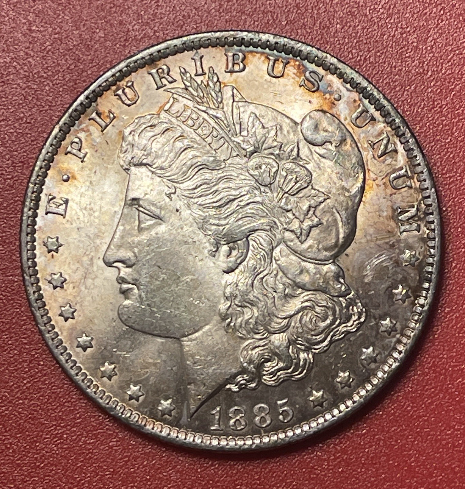1885 O Morgan Silver Dollar, Choice to Gem Uncirculated. Lovely Toning.