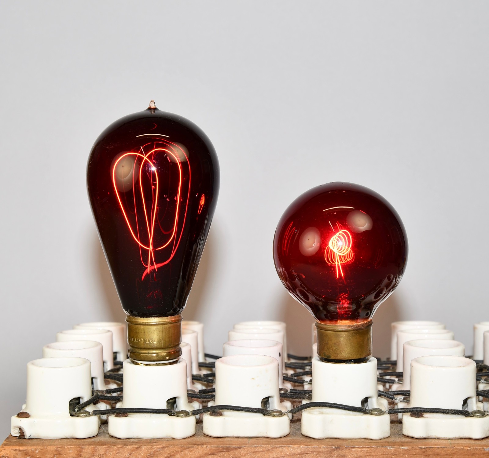 LOT OF 2 ANTIQUE RED GLASS CARBON TIP MEDIUM BASE E26 WORKING LIGHT BULBS!