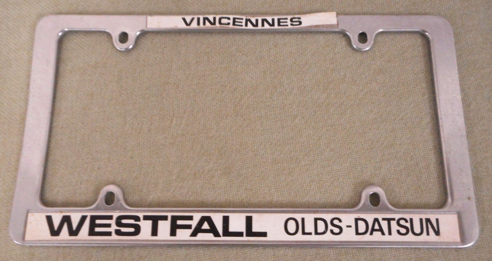 Vintage Westfall Olds-Datsun Dealer License Plate Frame