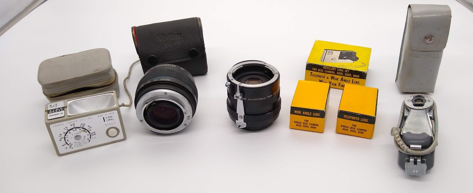Camera Lot 5 Pcs: Honeywell & Canon Flashes; Kodak Disc Lens; 2 Vivitar Lens VTG