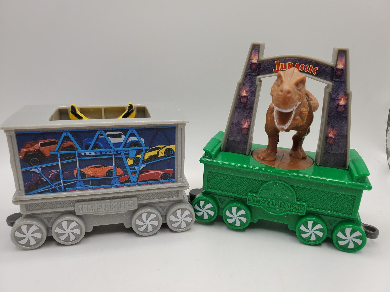 2017 McDonald's Happy Meal Transformers Holiday Express & Jurassic World Car Lot