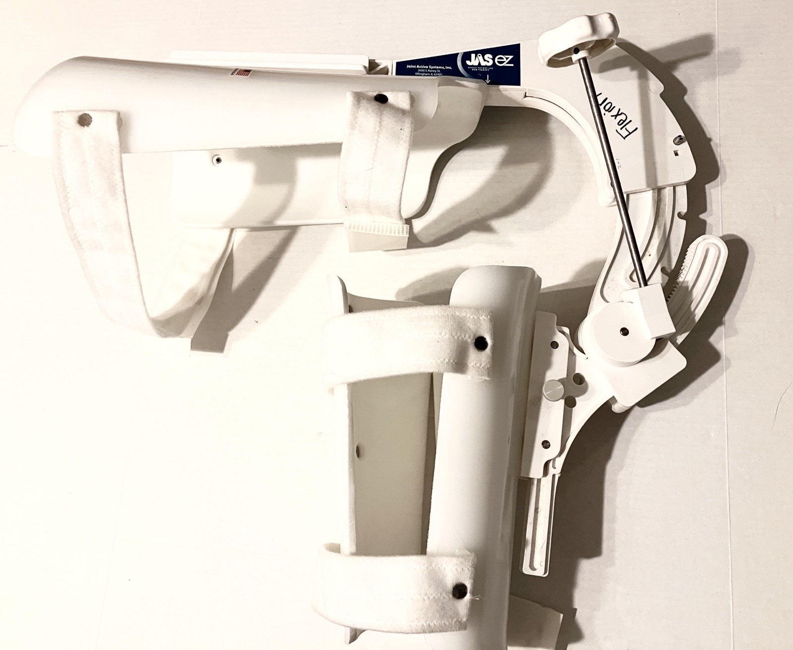 JAS Knee Flexion brace, white ridged plastic, large, very good condition.