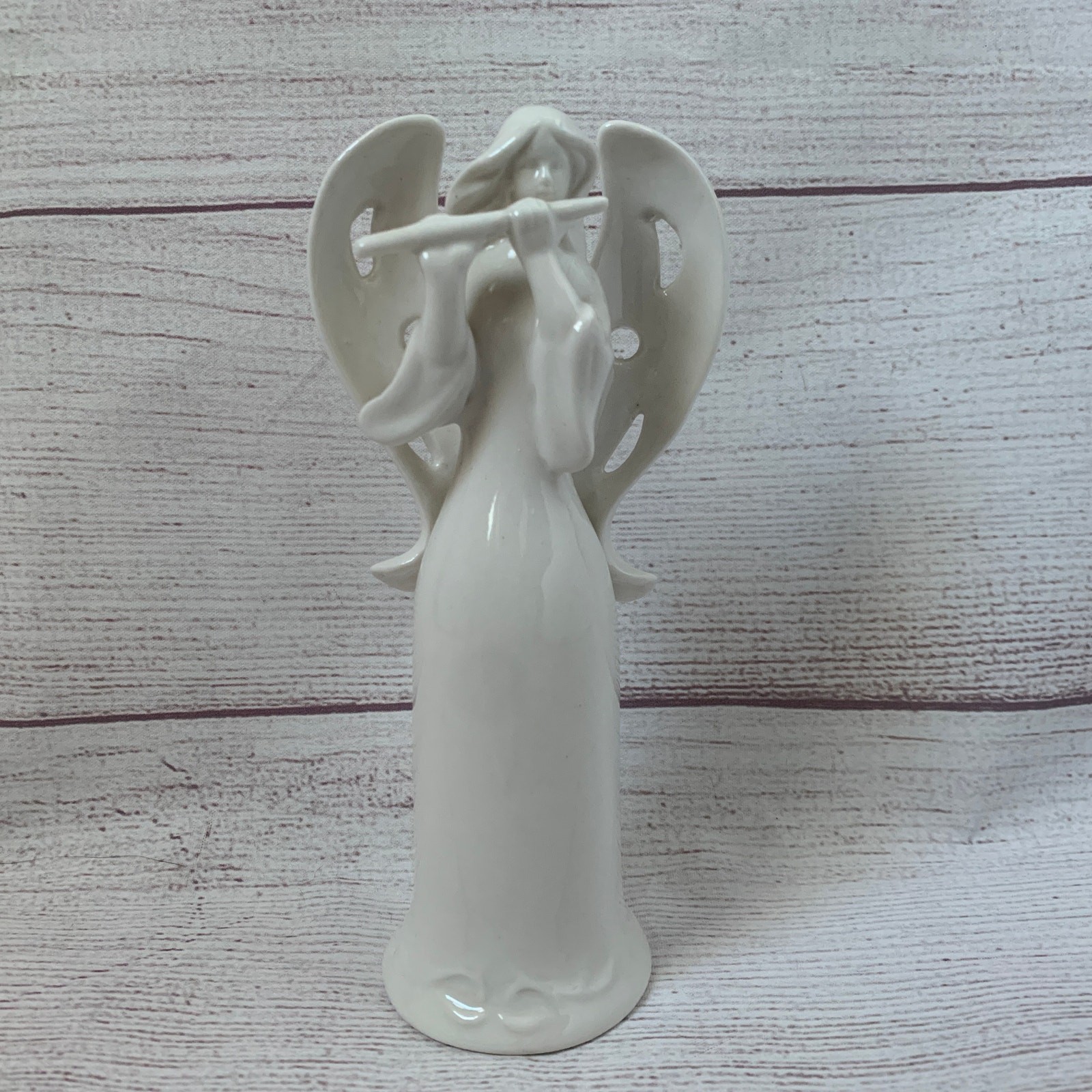 White Ceramic Angel Figurine Playing Flute Cutout Hole Wings Christmas 6 1/2"H