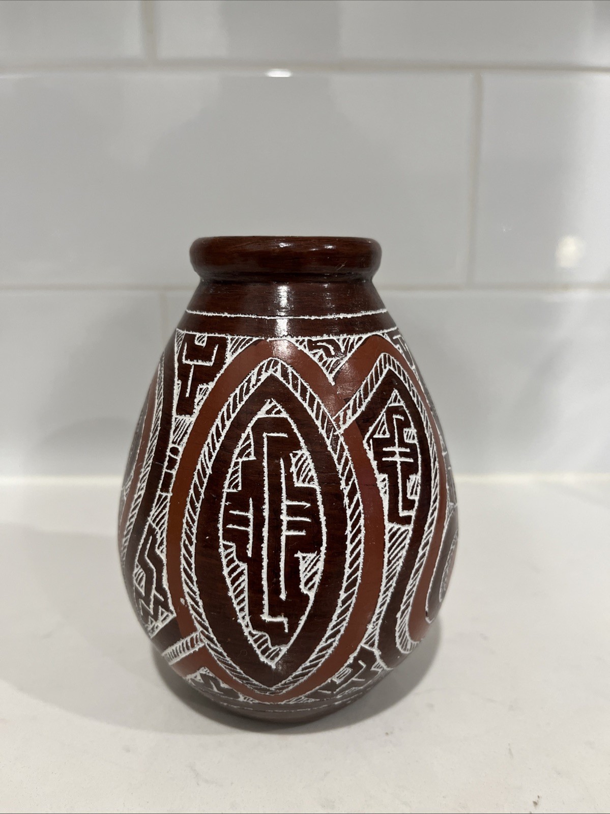 This is a handcrafted Marajoara terracotta vessel featuring intricate