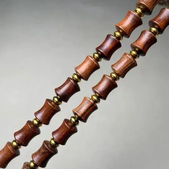 African Blackwood Yakdung with Glowing Amber Beads