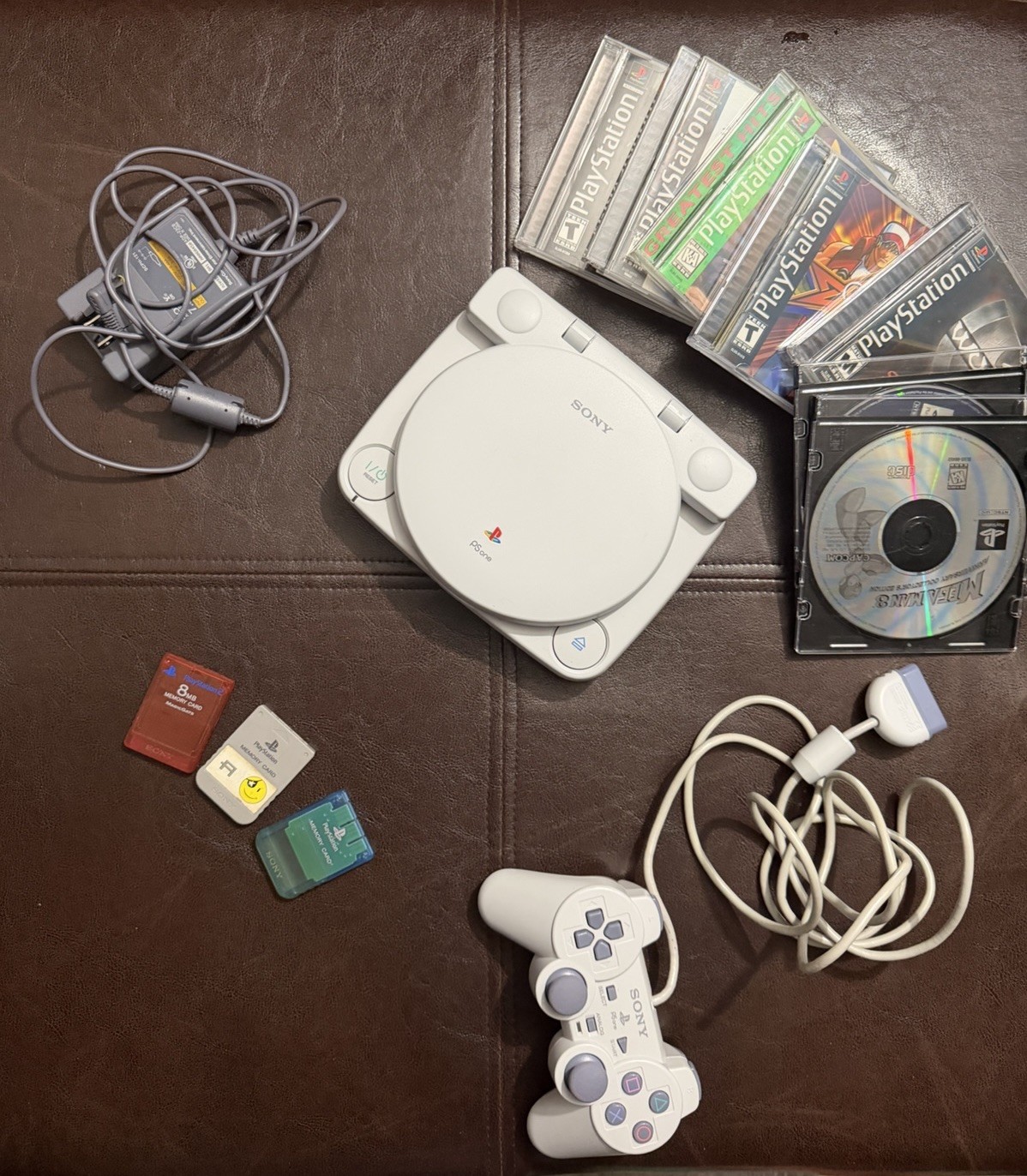 Sony PS1 SlimW/ LCD SCPH-101 Console Bundle Rayman Mega Man Wu-Tang KISS Games