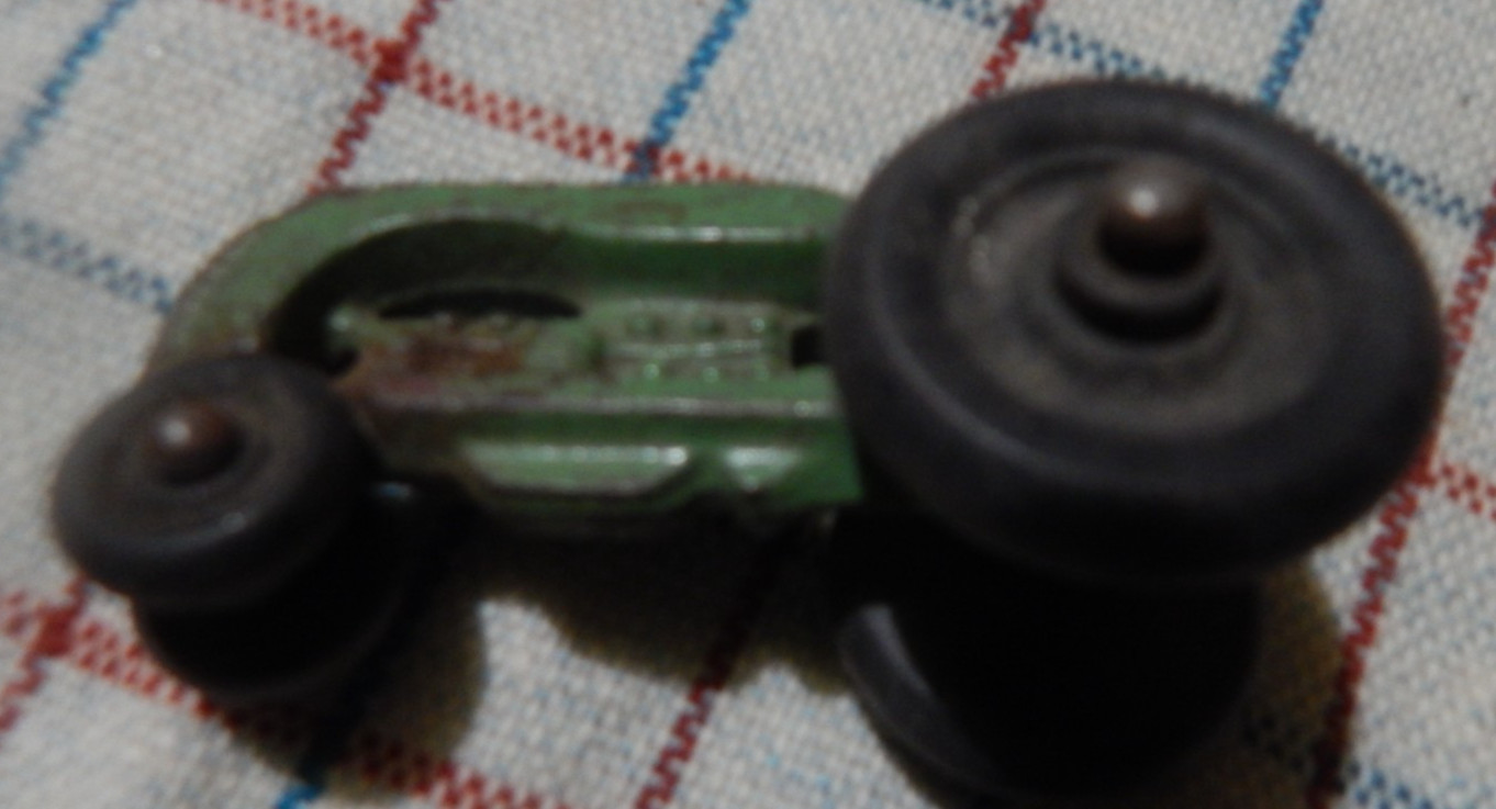 vintage small toy tracfor Cockshutt green hard rubber tires driver cast iron 2"